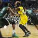 Michigan sophomore Tim Hardaway Jr. holds the ball around Ohio University sophomore T.J. Hall in the second half of the second round of the NCAA tournament at Bridgestone Arena in Nashville, Tenn.  Melanie Maxwell I AnnArbor.com